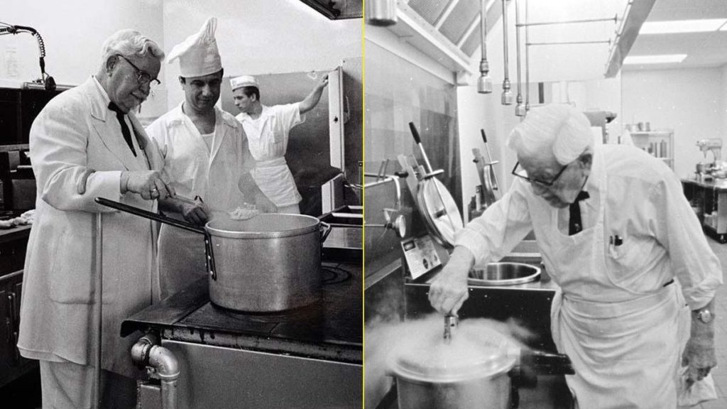 Coronel sanders en la cocina con trabajadores